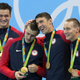 Team USA’s Nathan Adrian, Ryan Held, Michael Phelps, and Caeleb Dressel celebrate their win.